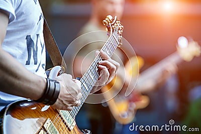 Guitarist playing live concert with rock band Stock Photo