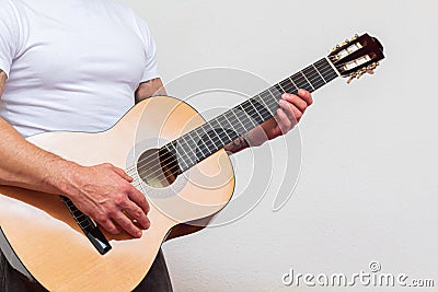 Guitarist playing musical instruments focus on hand. Solfeggio teacher teaching student Stock Photo