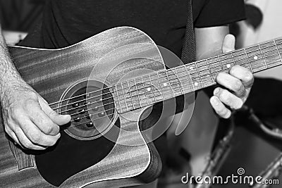The guitarist plays a solo in the studio Stock Photo