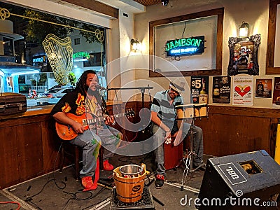 Guitarist Reggae Musician Keith Batlin sings and plays with drummer Editorial Stock Photo