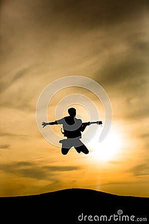 Guitarist silhouette jumping Stock Photo