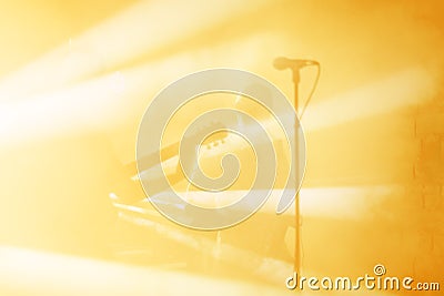 Guitarist silhouette perform on a concert stage. Abstract musical background. Music band with guitar player. Playing Stock Photo