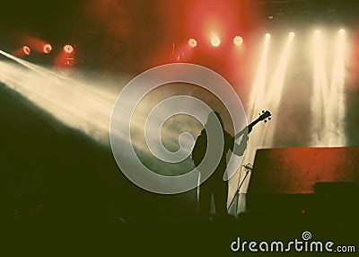 Guitarist silhouette in smoke during concert Stock Photo