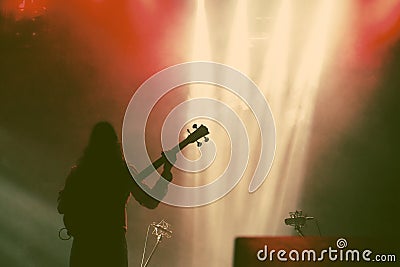 Guitarist silhouette in smoke during concert Stock Photo
