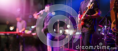 Guitarist on stage for background, soft and blur concept Stock Photo