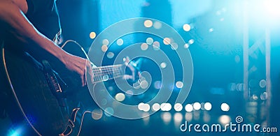 Guitarist on stage for background, soft and blur concept Stock Photo