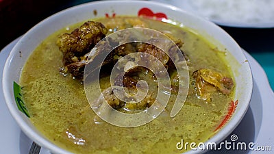 Gulai is a type of food containing rich, spicy and succulent curry-like sauce. Stock Photo