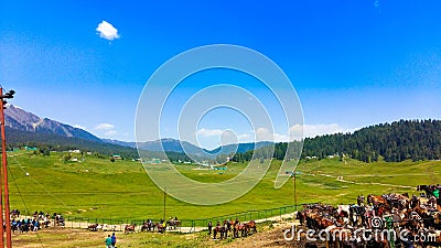 Gulmarg is a town, a hill station, a popular skiing destination and a notified area committee in the Baramulla district of Stock Photo