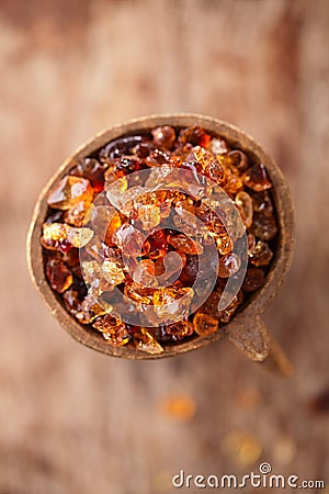 Gum arabic, also known as acacia gum - in bowl Stock Photo