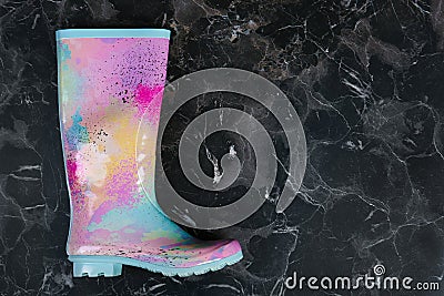 Gumboot on dark background, top view Stock Photo