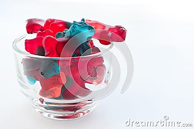 Gummy candies in glass bowl. jelly unicorn pattern. top view Stock Photo