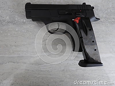 Gun black, spare magazines and leather holster on grey background Stock Photo