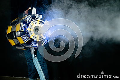 gun emits smoke on a dark background Editorial Stock Photo