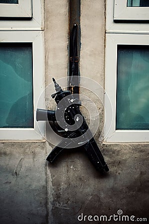 Gun hanging outside of a kitchen window Stock Photo