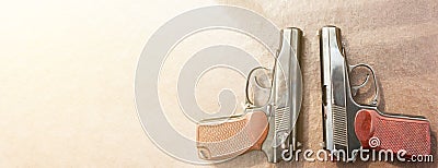 The gun lies on a table on old village boards legalization of weapons. Copyspace Stock Photo