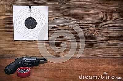 Gun and paper target. Shooting practice. Shooting range. Stock Photo