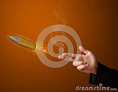 Gun shaped male hand with bullet Stock Photo