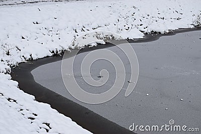 Gunderath, Germany - 01 05 2021: frozen Heilbachsee, dangerously thin ice Stock Photo