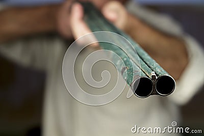 Gunpoint of double-barreled shotgun, pointing to camera Stock Photo