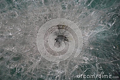 Gunshot marks on bulletproof glass Stock Photo