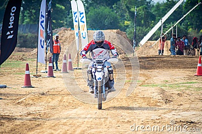 shot of off road dirt bike rider navigating rough track and then speeding to fast stop in a hero xpulse offroad Editorial Stock Photo
