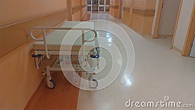 Gurney or wheeled stretcher at hospital corridor. long corridor in hospital with surgical transport Stock Photo
