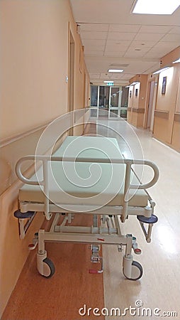 Gurney or wheeled stretcher at hospital corridor. long corridor in hospital with surgical transport Stock Photo