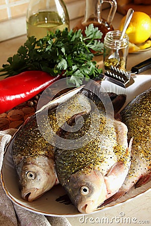 Gutted fish, sprinkled with spices Stock Photo