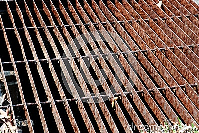 Gutters drain grate, drain cover. Road drains - sewer cover. iron grate of water drain on the road in every city. Water go down to Stock Photo