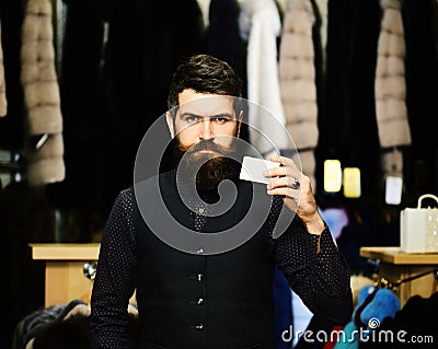 Guy with beard and business card. Businessman with empty paper Stock Photo