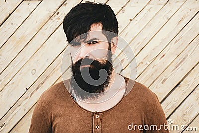 Guy with beard and modern hairstyle on street. Handsome male model - beard mustache and hairdo wears casual shirt. Stock Photo