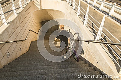 Guy with a bicycle riding around town. Bike bmx Editorial Stock Photo