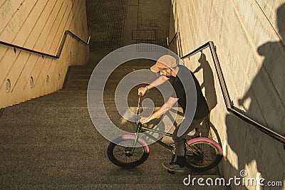 Guy with a bicycle riding around town. Bike bmx Editorial Stock Photo