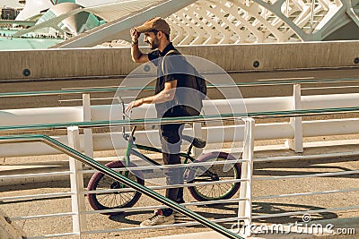 Guy with a bicycle riding around town. Bike bmx Editorial Stock Photo