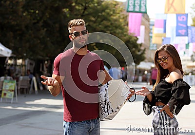 The guy is confused that there is nothing in the bag for him. Stock Photo