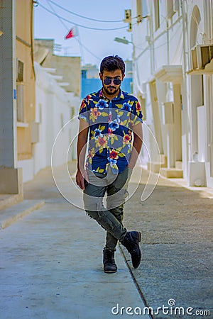 Handsome guy posing in the middle of the street Stock Photo