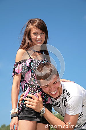 Guy embraces girl for waist Stock Photo