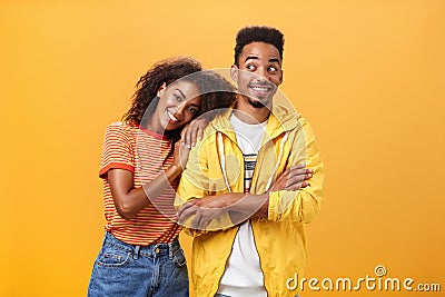 Guy feeling happy girl lean on his shoulder grinning and chuckling from happiness standing pleased and joyful over Stock Photo