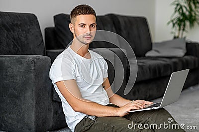 Guy freelancer with laptop working at home Stock Photo