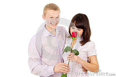 The guy gives a girl a rose, makes a proposal Stock Photo