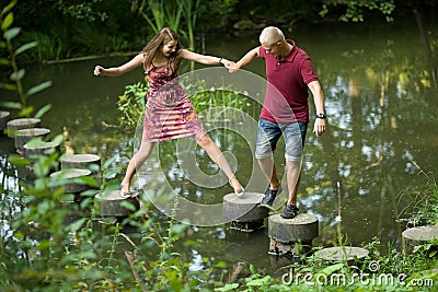 Guy helps girl Stock Photo