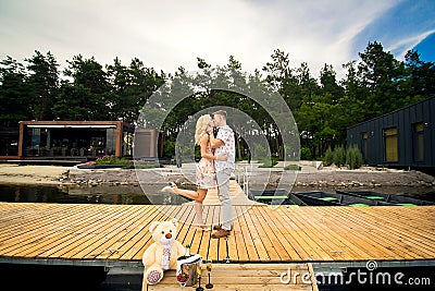 Guy kissing a girl on the pier Stock Photo