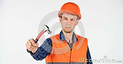 Guy knoking hammer professional master repair wear helmet uniform, good tools concept Stock Photo