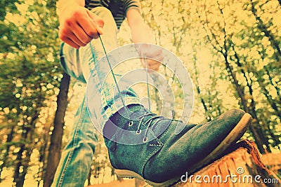 A guy lacing shoes, wide-angle photo, bottom view Stock Photo