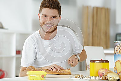 Guy making sandwhich at home Stock Photo