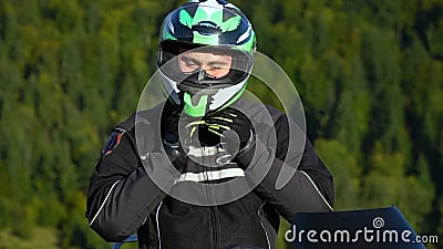 A Guy on a Motorcycle. Young Handsome Guy with His Motorcycle in the