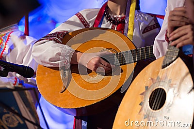 The guy plays a stringed folk instrument Stock Photo