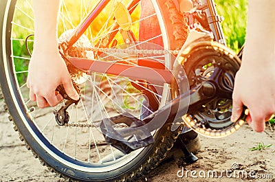 The guy repairs the bicycle. chain repair. cyclist. unratitude o Stock Photo