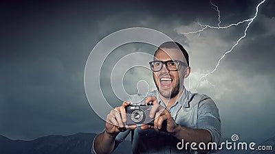 Guy with retro photocamera. Mixed media Stock Photo