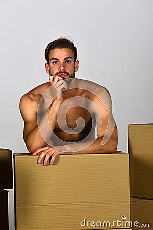 Guy with sexy torso leaning on his fist Stock Photo